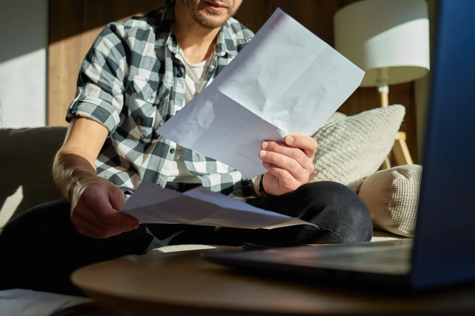 man-opening-irs-cp3219a-letter