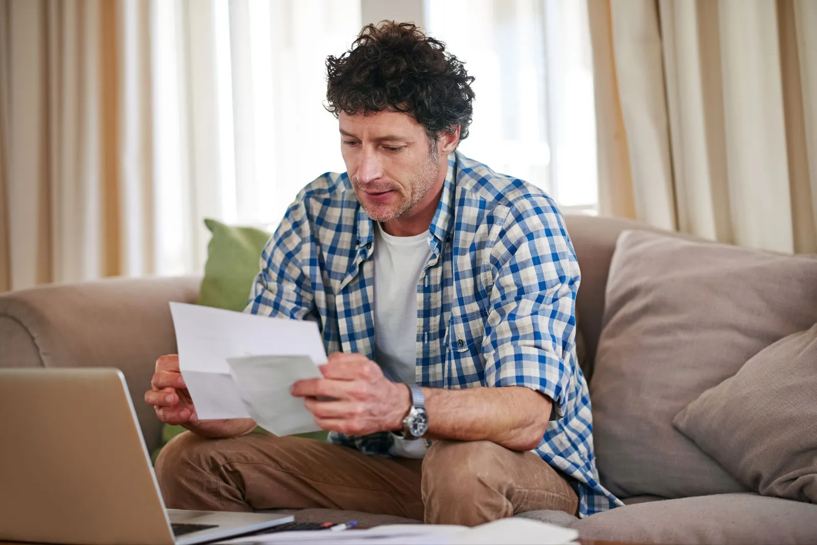 man-opening-letter-from-irs-revenue-officer